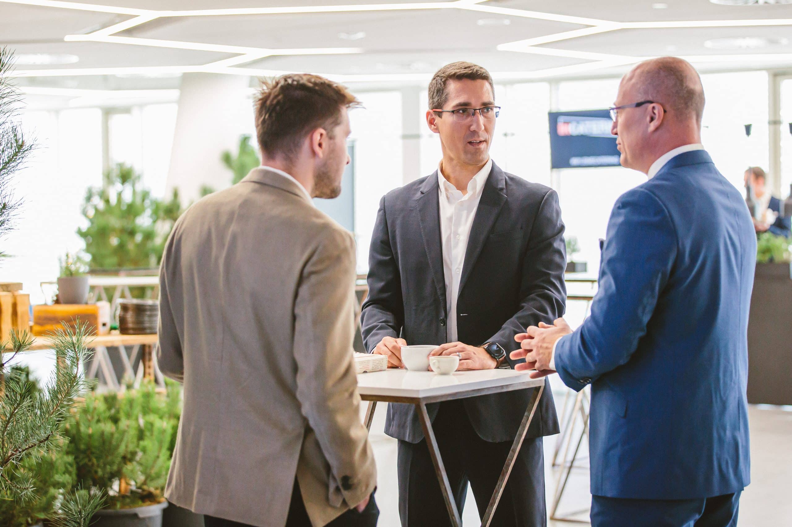 Transformation Summit attendees talking in the foyer